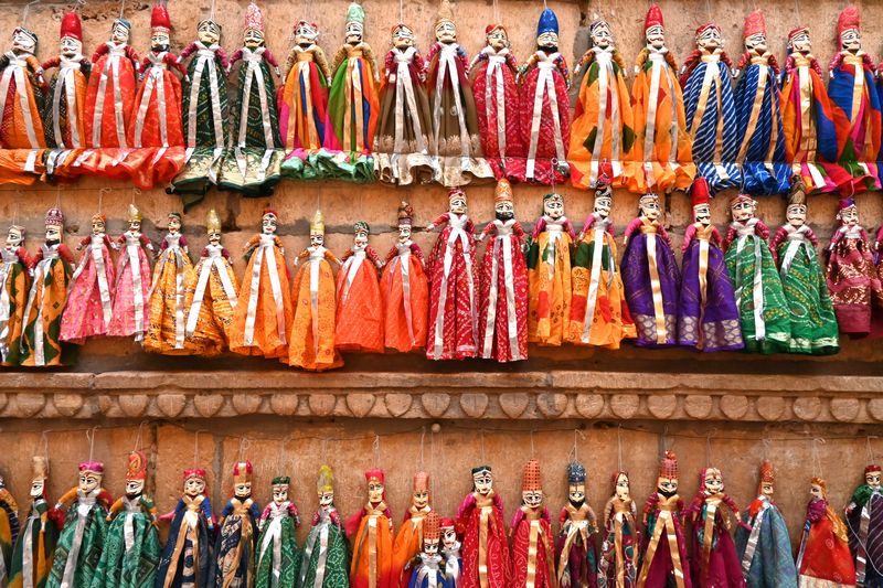 Display of variety of Rajasthani puppets in a market in Jaisalmer, Jaisalmer blog by The Kid Who Travelled.