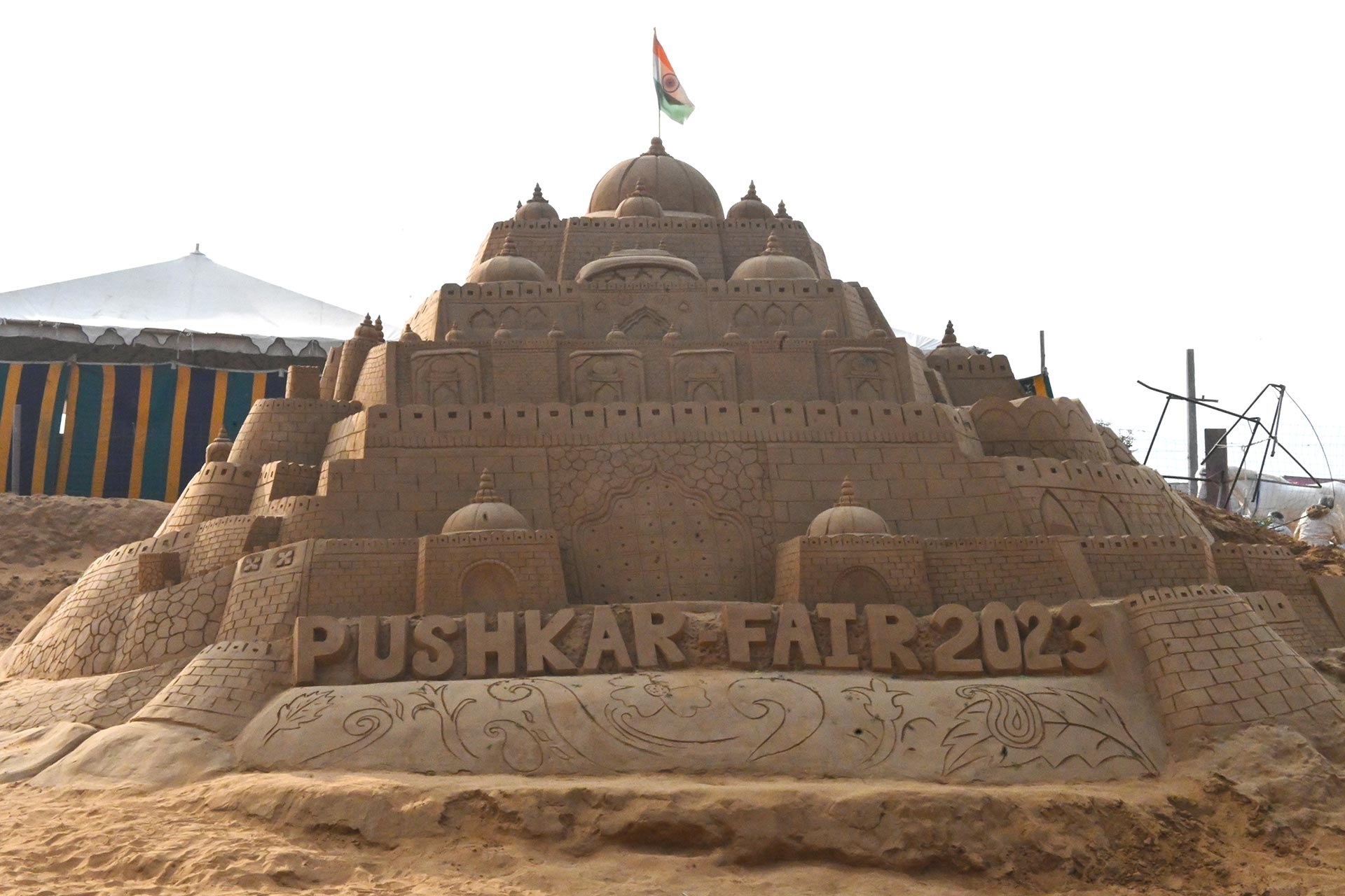 Intricate sand art showcasing Delhi Red fort at the Pushkar Fair.