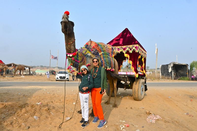 The Kid Who Travelled with decorated Camel at the Pushkar Camel Fair in Pushkar Rajasthan