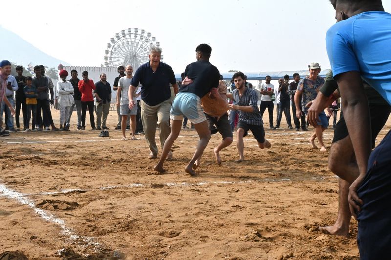 Foreign nationals playing kabaddi game with locals in a cultural event at the Pushkar fair, blog by The Kid Who Travelled.