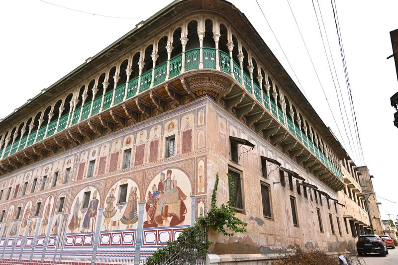 Exterior view of Poddar Haveli in Nawalgarh, showcasing intricate Rajasthani architecture and vibrant frescoes, Shekhawati blog by The Kid Who Travelled.