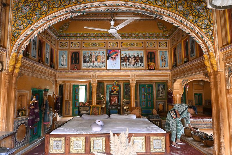 Traditional Rajasthani decor inside a Shekhawati haveli, featuring antique furniture and textiles.